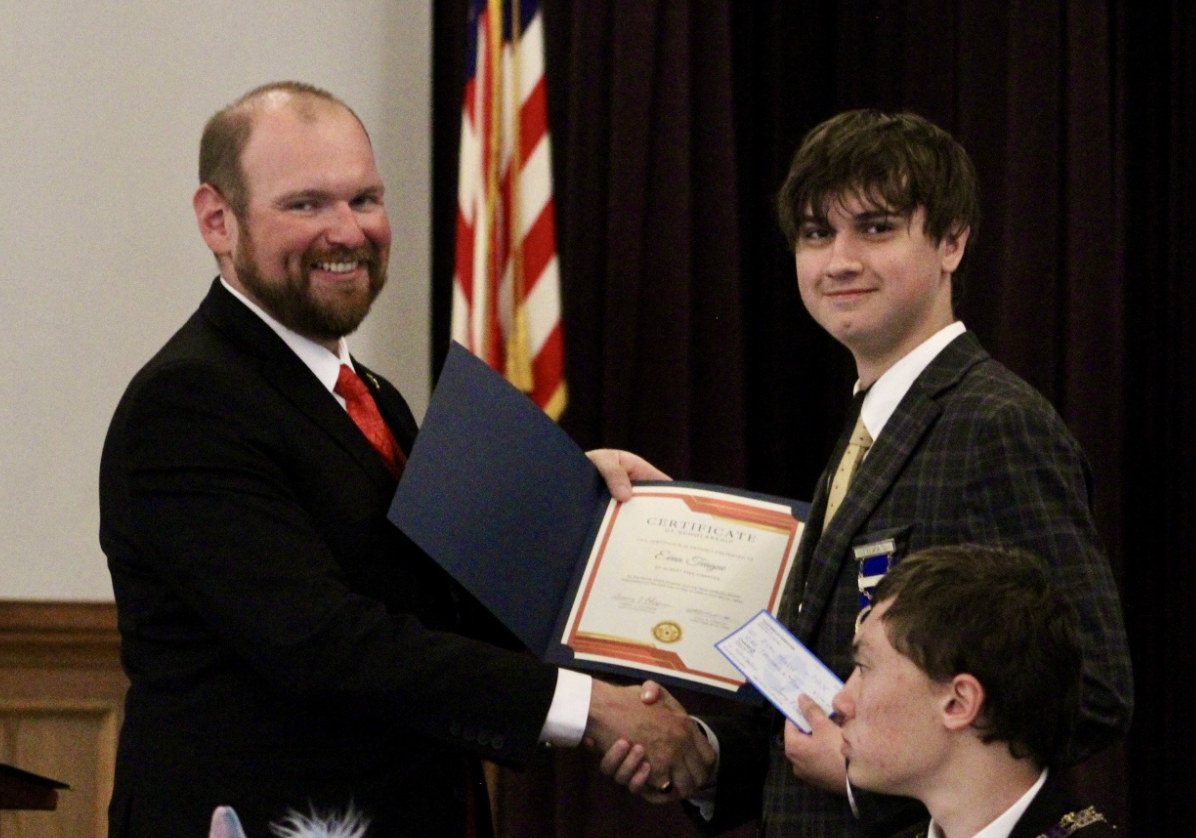 A member earning a scholarship from the alumni association.